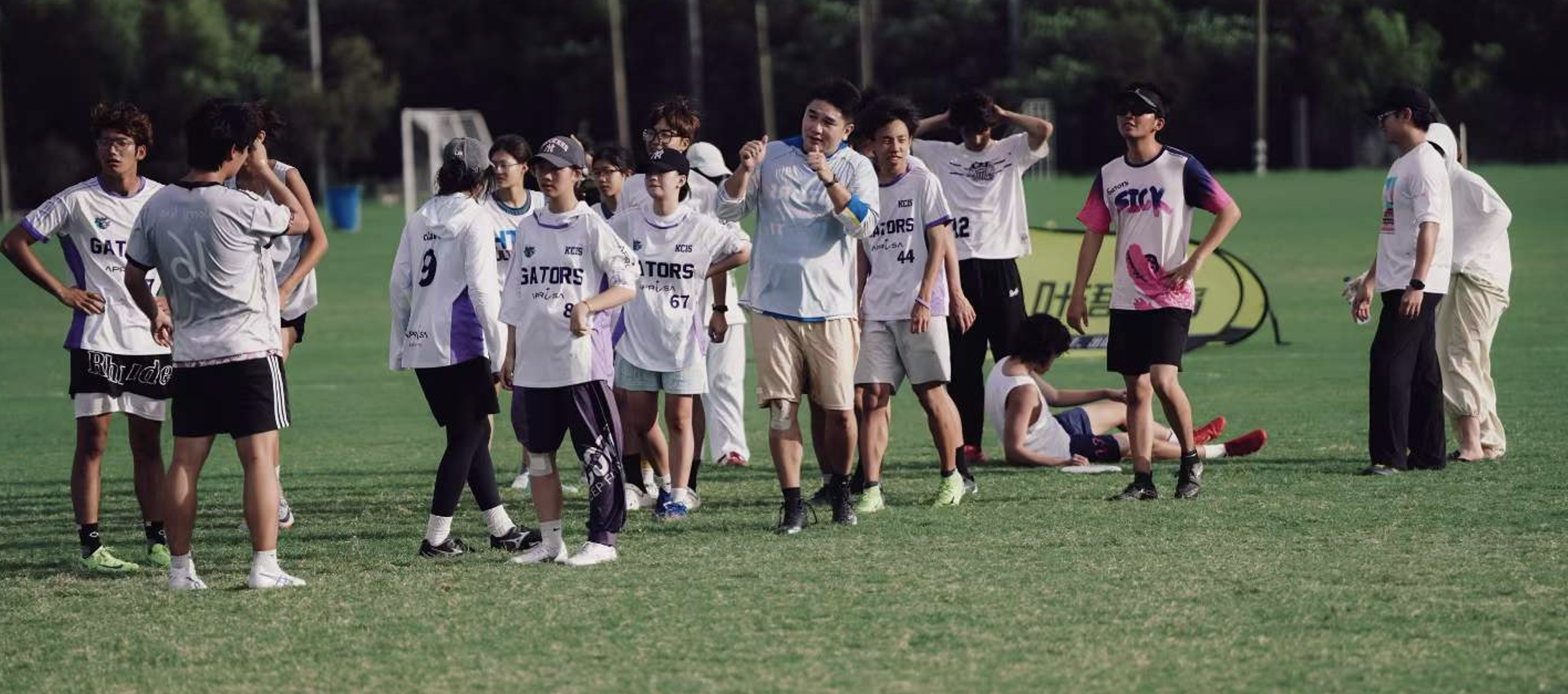 Students together on a frisbee field